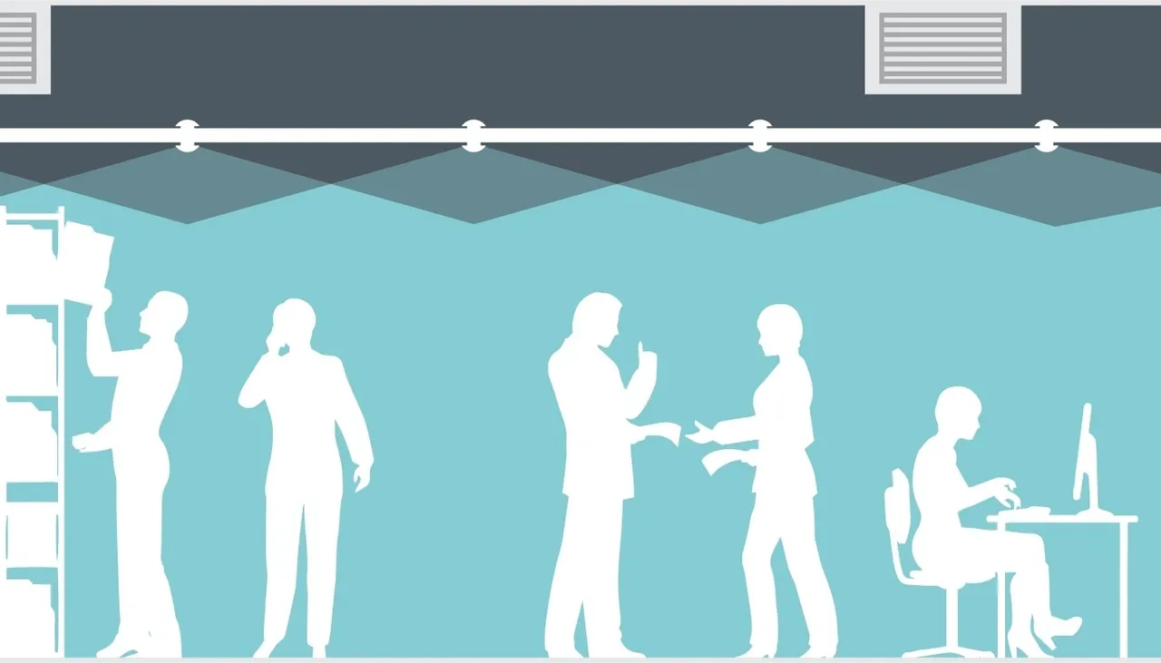 Silhouettes of businesspeople networking and shaking hands under spotlights.